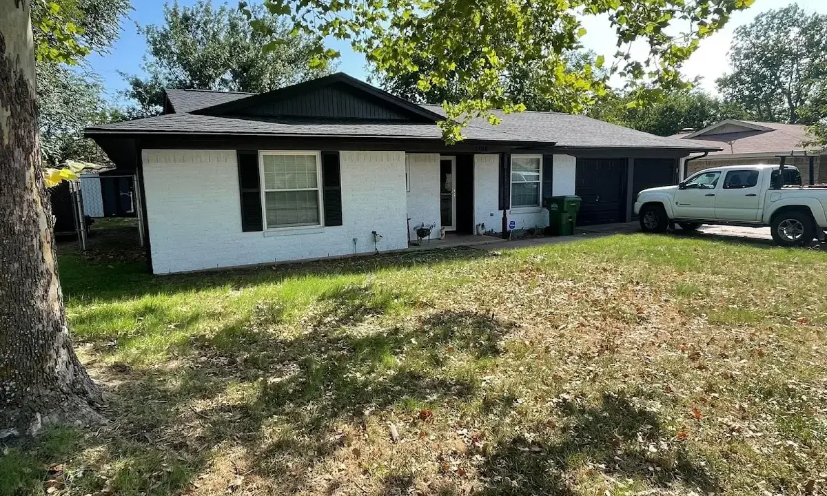 Professional roofing crew working on a residential roof in Centennial